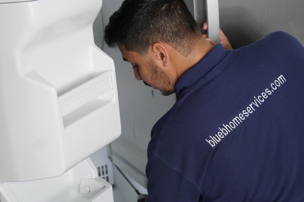 Close-up checking a worn refrigerator door gasket in Broward County.