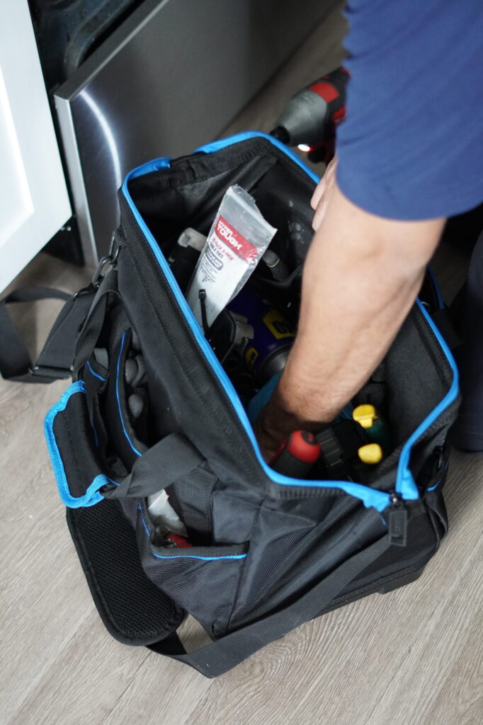 Using an oven thermometer to verify temperature calibration.