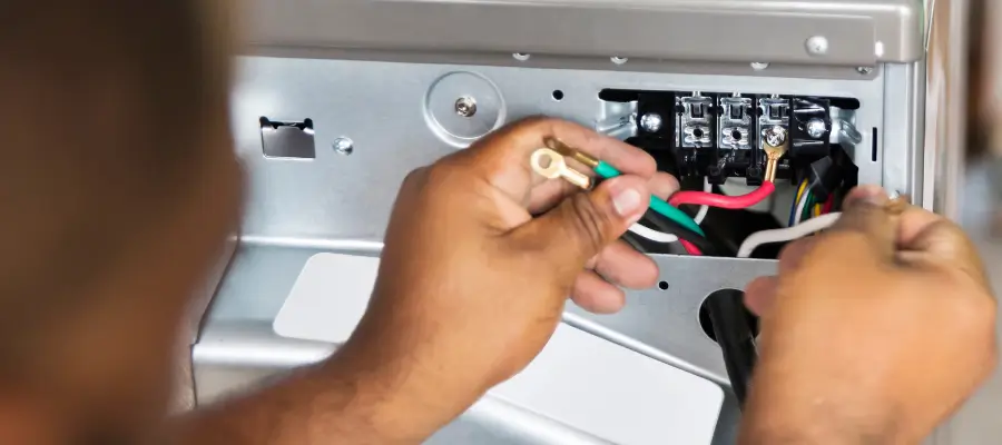 Bosch dryer door switch being replaced during a repair.