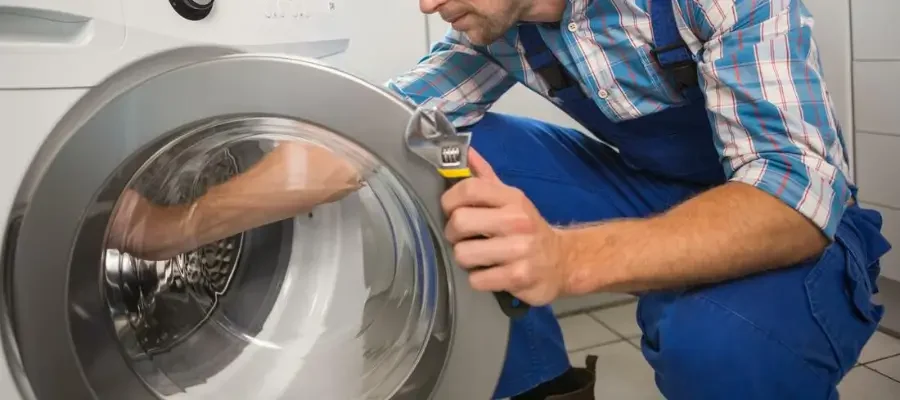 Technician diagnosing a Bosch dryer with a startup problem.
